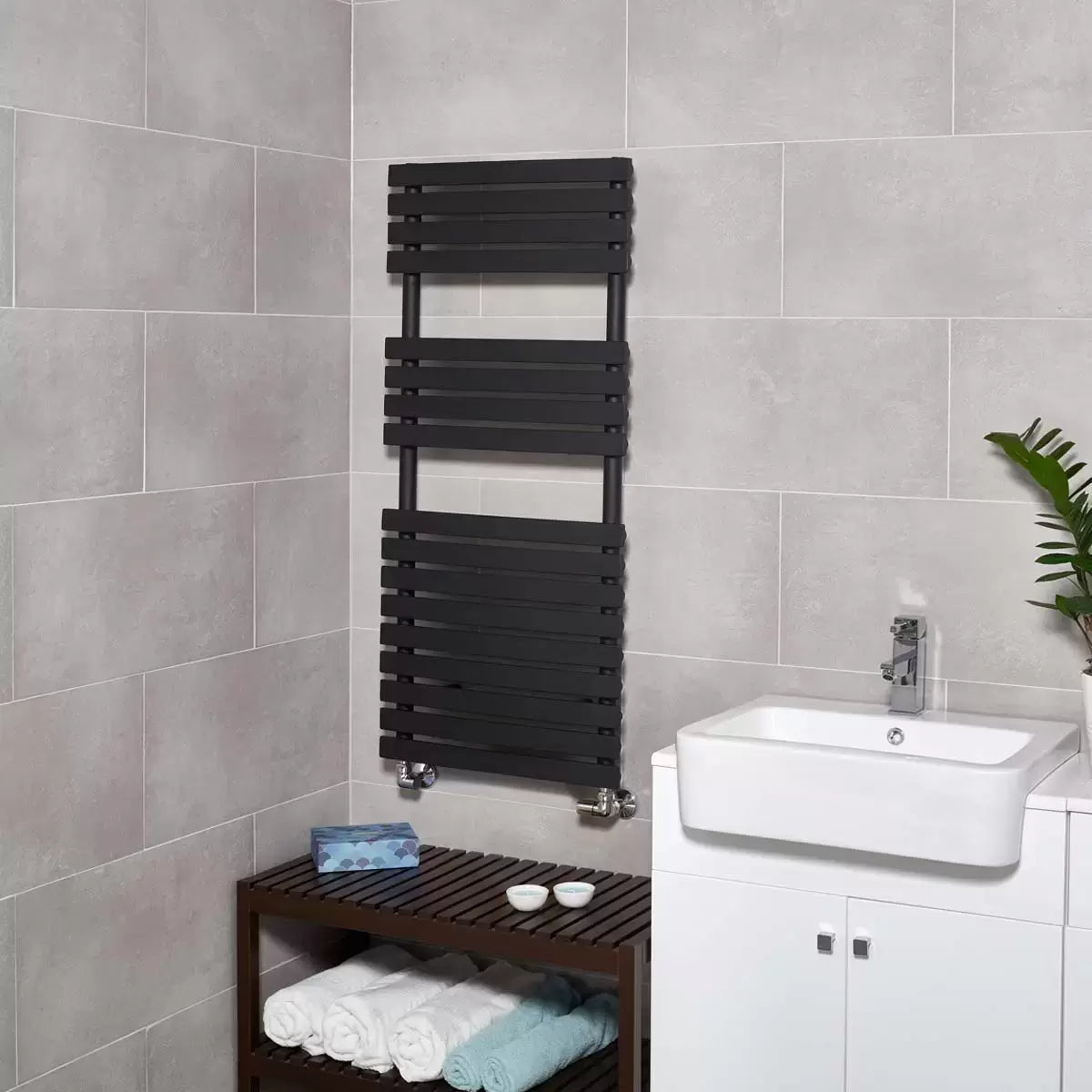 Front angle view of the Ultraheat Poplar Radiator featuring 17 flat horizontal bars in a dark micro grain textured finish mounted against a light tiled bathroom wall.