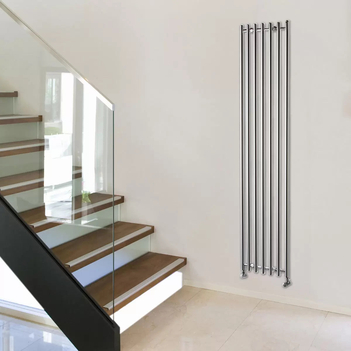 Front view of a tall, curved Ultraheat Trojan vertical radiator in a contemporary living room setting.