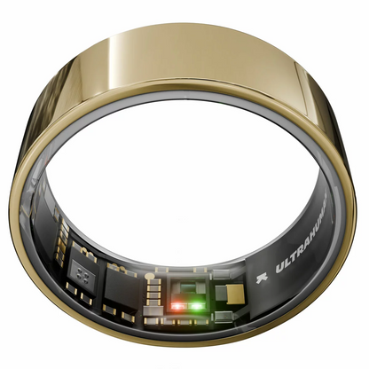 Ultrahuman Ring AIR Bionic Gold smart ring in a matte metallic finish, showcasing its smooth interior biometric sensors against a minimalist modern office backdrop.