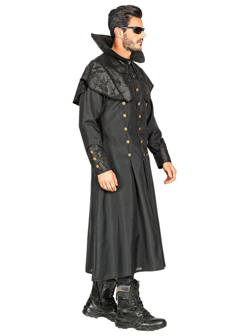 Front view of an adult male wearing a long black undertaker trench coat with wide-brim hat against a dark backdrop.
