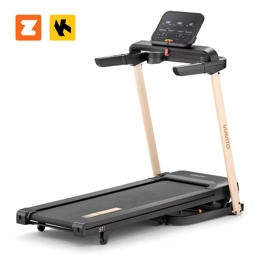 Black Viavito ST1 folding treadmill with LED display and tablet holder, shown fully set up on a dark floor in a modern home gym setting.