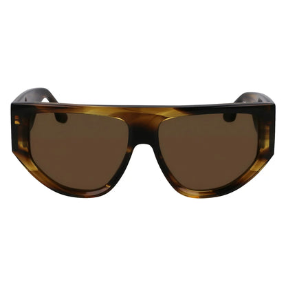Side-profile view of the vibrant Victoria Beckham VB 676S 318 sunglasses resting on a dark, reflective surface in bright, natural light.