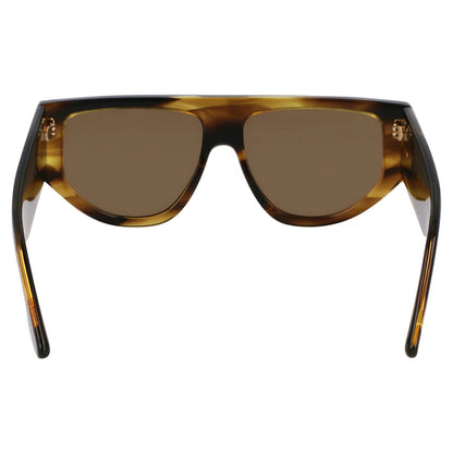 Side-profile view of the vibrant Victoria Beckham VB 676S 318 sunglasses resting on a dark, reflective surface in bright, natural light.