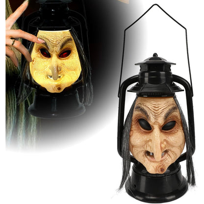 A handcrafted vintage Halloween long hair witch hanging decoration with LED lights and sound effects displayed in a spooky garden setting.