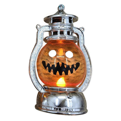 A vintage electroplated plastic electronic Halloween pumpkin lantern glowing softly on a decorative tabletop.