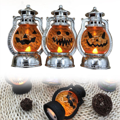 A vintage electroplated plastic electronic Halloween pumpkin lantern glowing softly on a decorative tabletop.