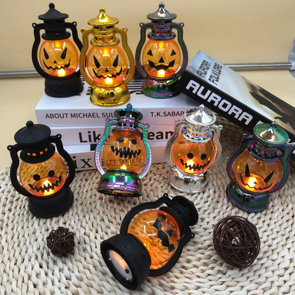 A vintage electroplated plastic electronic Halloween pumpkin lantern glowing softly on a decorative tabletop.