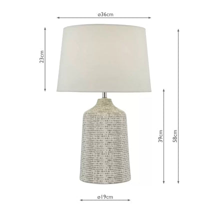 Front view of the Vondra ceramic table lamp showing its abstract hand-glazed grey and white ceramic base and textured ivory linen shade on a light oak bedside table.