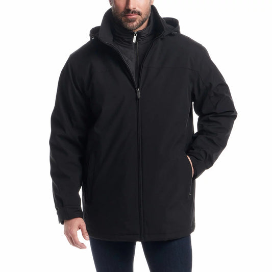 Weatherproof men's navy blue Ultra Tech jacket with zip-up quilted bib and fleece-lined hood shown on a model outdoors.