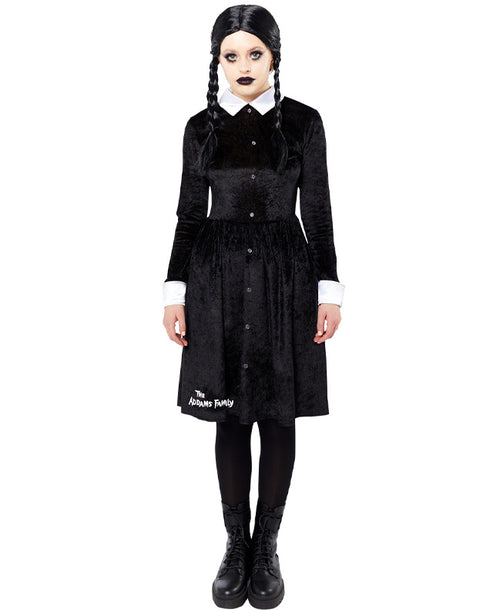 Front view of the black Wednesday Addams adult dress featuring sharp white pointy collar and cuffs on a minimalist studio background.