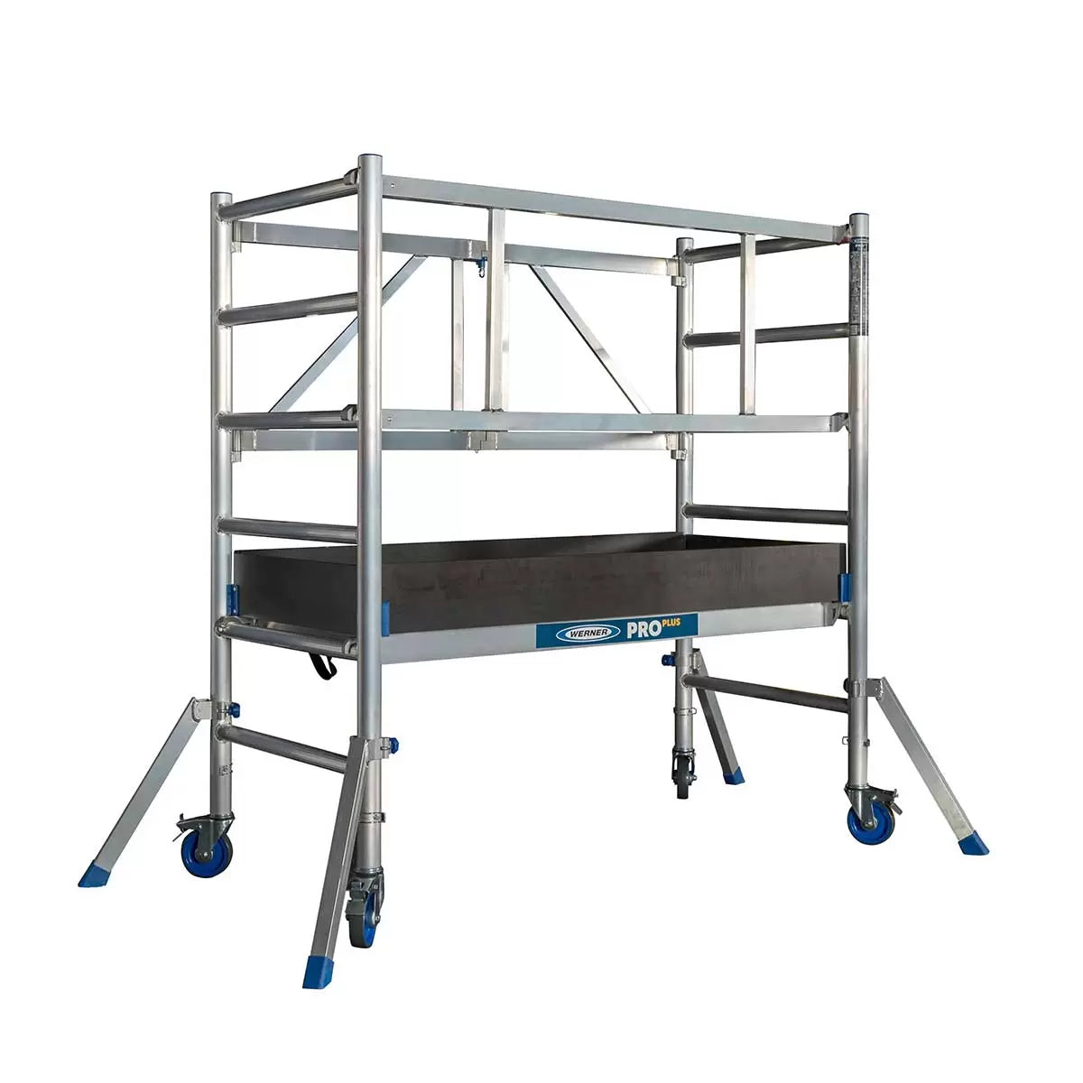 A silver aluminium Werner PROPLUS folding scaffold tower base pack with black swivel castors, a platform deck featuring an integrated trapdoor, and protective wooden toe boards set against a plain backdrop.