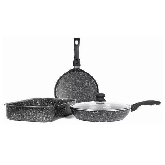 Four-piece Westinghouse Black Marble Series cookware set including a 35cm roasting tin, 28cm pancake pan, and 28cm lidded frying pan on a kitchen island.
