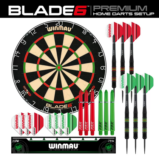Front-facing studio shot of the round black and green Winmau Blade 6 dartboard displaying its silver razor wiring, shown alongside two sets of brass steel-tip darts and a green oche strip.