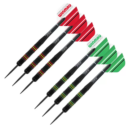 Front-facing studio shot of the round black and green Winmau Blade 6 dartboard displaying its silver razor wiring, shown alongside two sets of brass steel-tip darts and a green oche strip.