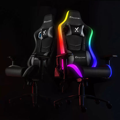 Black PU leather X Rocker Opal RGB gaming chair with colorful Neo Motion LED piping glowing along the backrest in a modern dark gaming room.