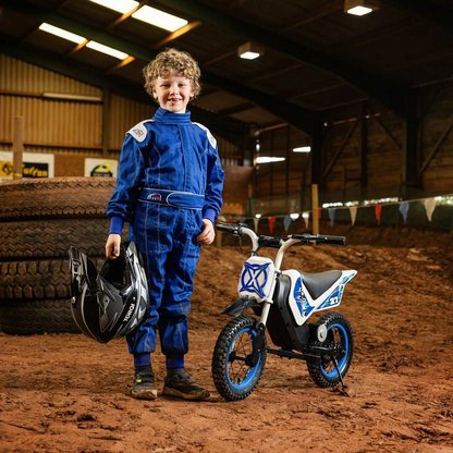 Black and red Xootz Cobolt 12V kids electric ride-on motorbike with 12-inch inflatable off-road tires parked on a dirt path.