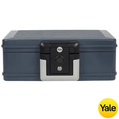 Front view of the black Yale 6.9L medium fire and waterproof chest safe with key lock and integrated handle sitting flat on a wooden surface.