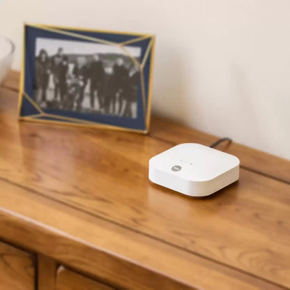 Complete 10-piece Yale IA-320 Sync Smart Home Alarm kit displayed against a white background featuring the yellow siren box, white smart hub, keypad, three door contacts, and four PIR motion sensors.