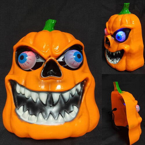 Yellow LED light-up scary Halloween mask with vivid illuminated criss-cross stitching set against a dark, pitch-black background.