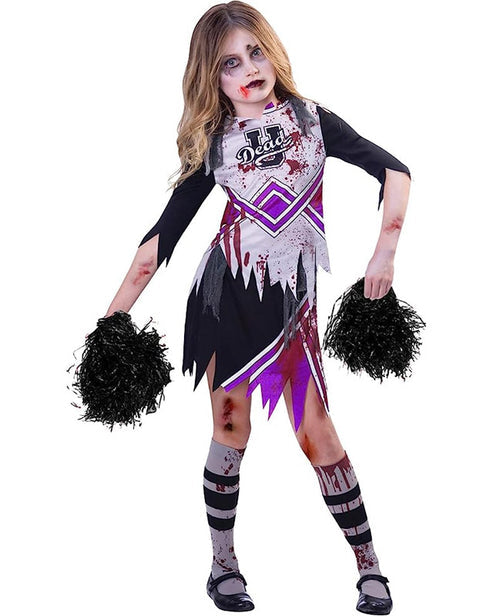 Front view of a child wearing a tattered red and black zombie cheerleader costume holding distressed pom-poms against a dark background.