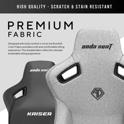 Front angle view of the grey linen fabric anda seaT Kaiser Series 3 large gaming chair showing the magnetic neck pillow and 4D armrests in a brightly lit modern office setup.
