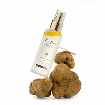 Two 180ml bottles of d'Alba White Truffle First Spray Serum displayed elegantly, highlighting the dual-phase liquid formula.