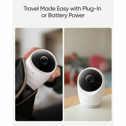 White eufy E21 smart baby monitor camera with pan tilt lens resting beside the 5 inch handheld color screen parent display unit.