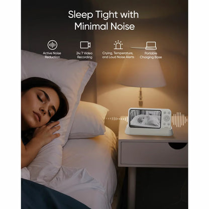 White eufy E21 smart baby monitor camera with pan tilt lens resting beside the 5 inch handheld color screen parent display unit.