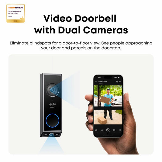 A sleek matte black eufy E340 dual-camera video doorbell mounted onto a modern brick facade beside a white wireless chime plug.
