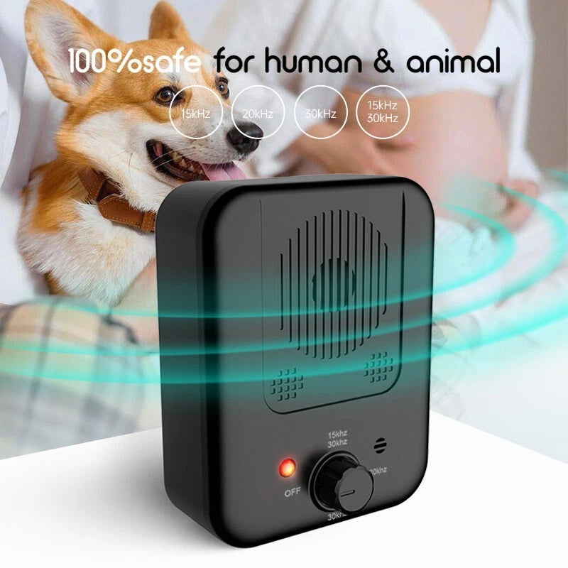 Handheld ultrasonic anti barking device pointed at a barking dog outdoors showing 3-level control button-3