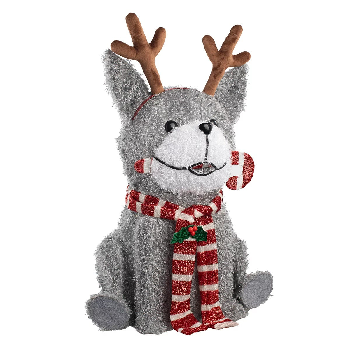 Three illuminated outdoor LED Christmas dog figures standing on a green lawn wearing festive scarves and headbands at twilight.