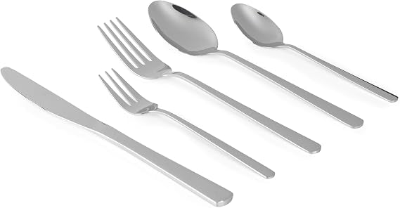 Russell Hobbs Vienna 60-piece silver mirror-polished stainless steel cutlery set arranged neatly on a dining table including knives, forks, and spoons.