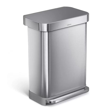 Front angle view of the simplehuman 55L brushed stainless steel step bin with grey plastic lid set against a bright modern kitchen backdrop.