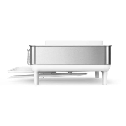 simplehuman stainless steel dish rack with swivel spout drainer on a clean kitchen countertop