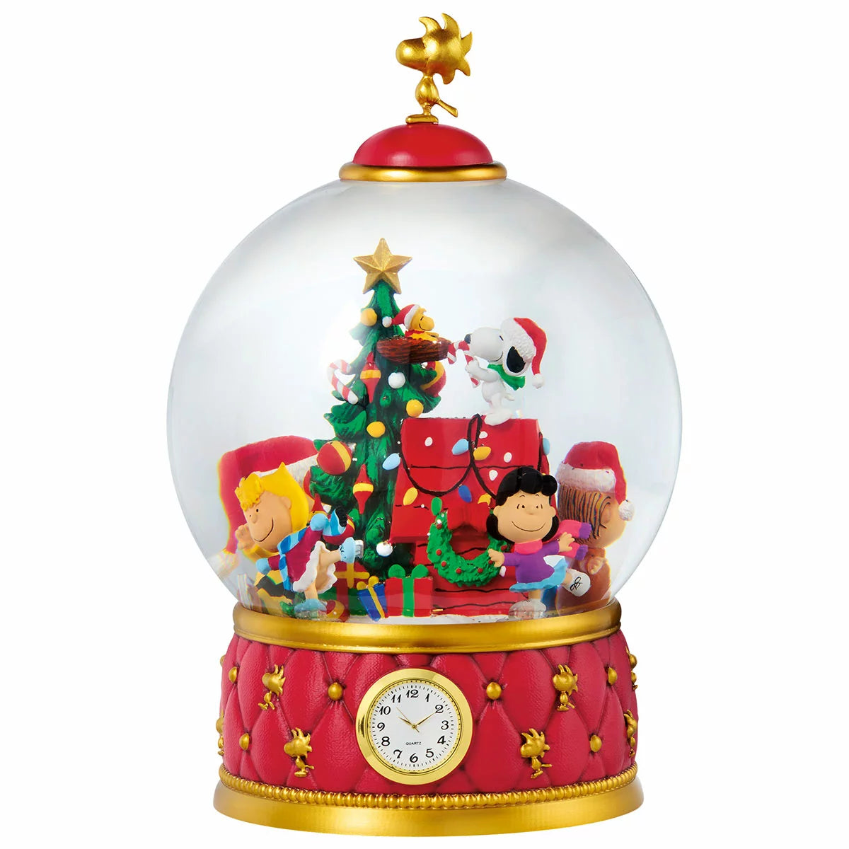 A large, heavy-duty Christmas snow globe featuring intricately sculpted holiday characters, resting on a wooden surface with swirling glitter illuminated by warm internal LED lights.