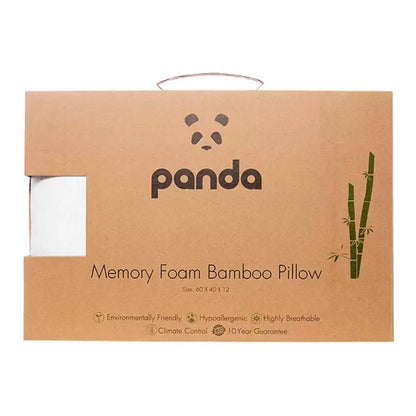 White Panda memory foam pillow featuring a textured silky bamboo cover with subtle brand detailing, shown resting horizontally on a minimalist wooden bed frame.