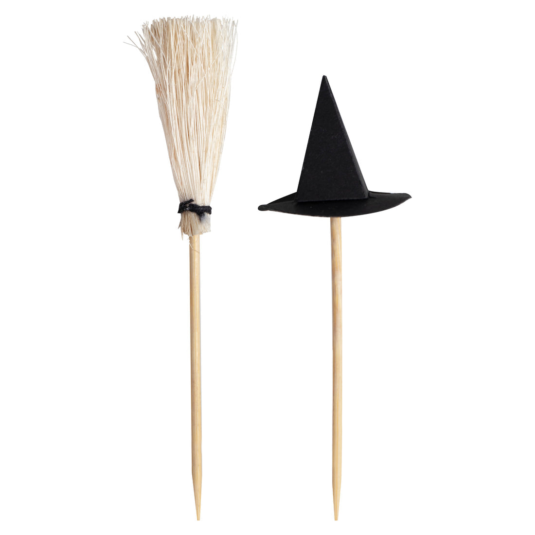 Six spooky Witches Hats and Broomsticks Cocktail Sticks arranged neatly beside a dark purple Halloween cocktail garnished with blackberries.